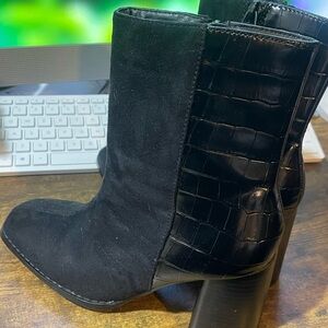 Never wore booties. Super cute and fun with the metallic snakeskin look. Size 7